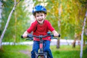 Acton Academy St. George - a young boy riding his bike.